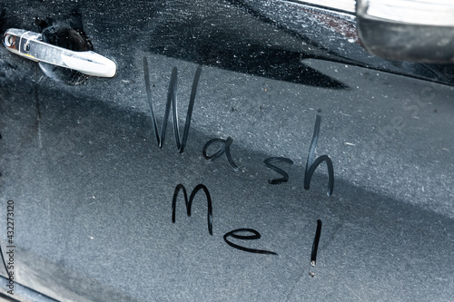 The cars are dirty, dirty, mud and dust. It has a message saying Wash me