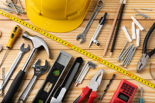 All tools supplies home construction on the wooden table background. Building tool repair equipments.