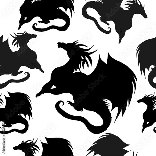 Seamless pattern with black silhouettes of a dragon on a white background