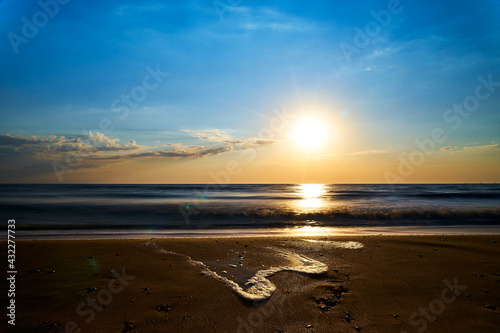Fototapeta Naklejka Na Ścianę i Meble -  Sea sunset. Quiet calm sea. Sand beach.