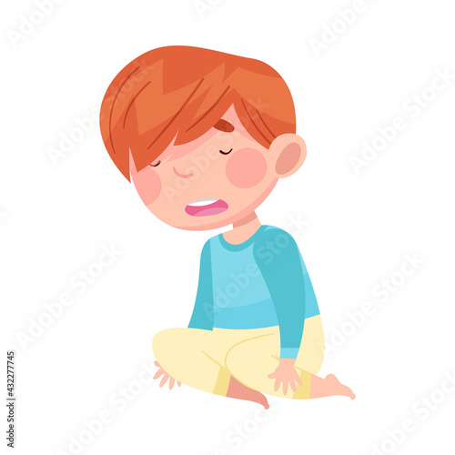 Sleepy Little Boy Wearing Pajamas Sitting on the Floor and Yawning Vector Illustration