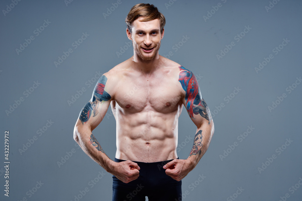 athlete with inflated torso bodybuilder Fitness tape measure and arm muscles strength