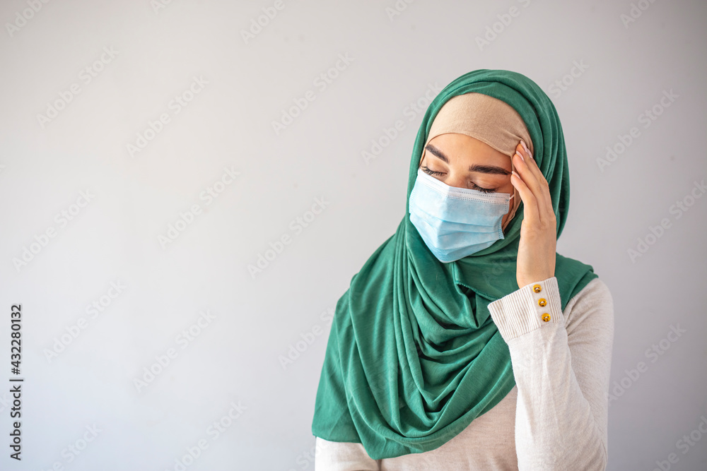 Sick muslim woman wearing mask with dirty polluted smog; concept of global warming, dirty air, air pollution, allergy sickness, breathing difficulty, sore throat, lung cancer, bad air quality