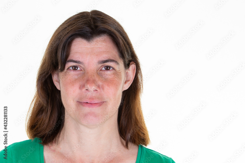 Happy middle aged woman in casual posing over white studio background Portrait aside copy space smiling at camera in Female portrait concept Happy middle aged woman in casual posing over white studio background Portrait aside copy space smiling at camera in Female portrait concept