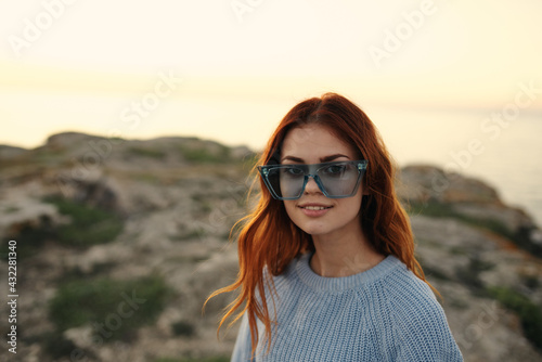 cheerful woman with glasses outdoors landscape island travel