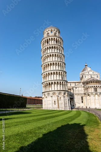 The Leaning Tower of Pisa and the Cathedral (Duomo di Santa Maria Assunta), Piazza dei Miracoli (Square of Miracles). Tuscany, Italy, Europe.