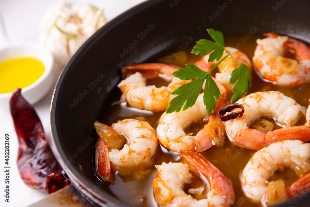 Gambas al ajillo. Shrimp Scampi. Traditional Spanish tapa with prawns cooked in oil with garlic and chilli. Gambas al ajillo. Shrimp Scampi. Traditional Spanish tapa with prawns cooked in oil with garlic and chilli.