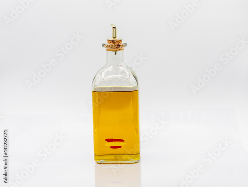 BOTTLE OF SPANISH OLIVE OIL WITH PITORRO on a white background photo