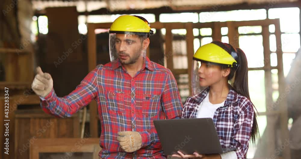 Hispanic man and asian woman who has the ability in carpentry to make woodwork for home use. Construction industry concept. Hispanic man and asian woman who has the ability in carpentry to make woodwork for home use. Construction industry concept.