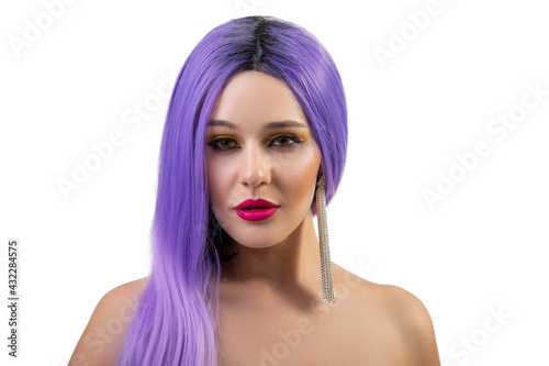 Portrait of beautiful young girl with fancy bright make-up and violet wig isolated on white background