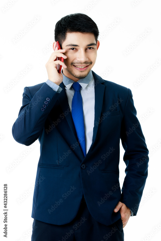 Portrait of focused young Asian businessman talk on the phone on isolated white background. Studio shot, business communication concept. Portrait of focused young Asian businessman talk on the phone on isolated white background. Studio shot, business communication concept.