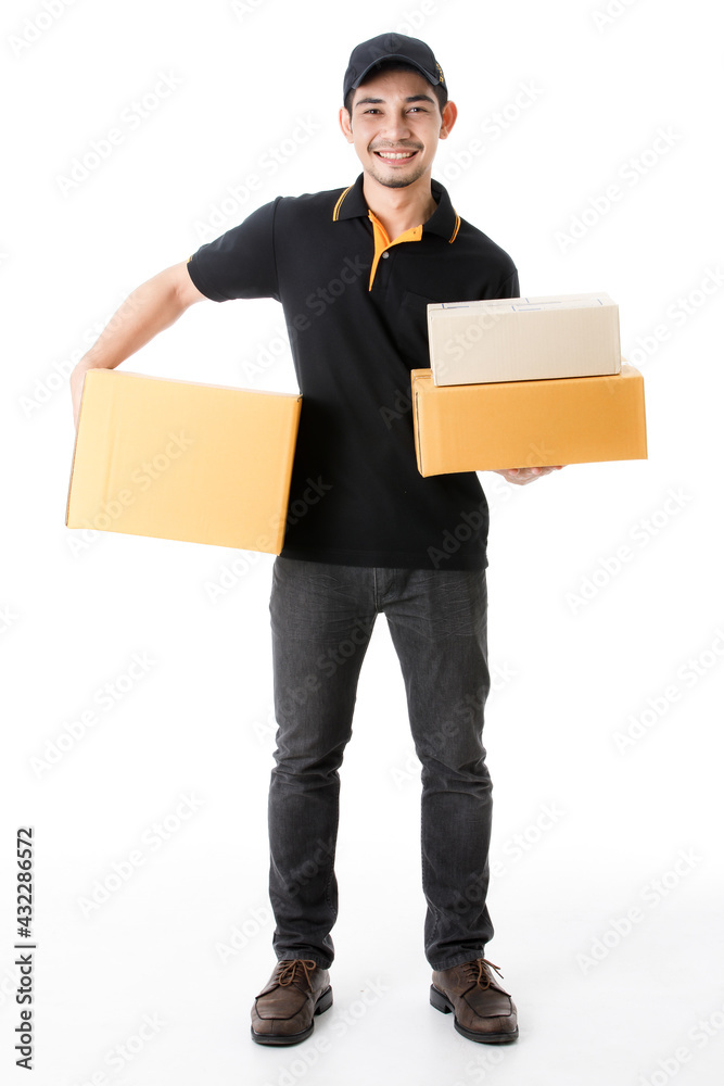 Joyful Asian delivery man holds packages in each hand, smile to camera. Studio full length portrait of courier guy in black uniform on isolated white background. E-commerce business concept. Joyful Asian delivery man holds packages in each hand, smile to camera. Studio full length portrait of courier guy in black uniform on isolated white background. E-commerce business concept.