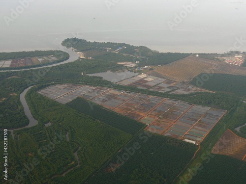 Photography Agricultural lands and palm plantation seen from an airlplane window approaching Kuala Lumpur, Malaysia