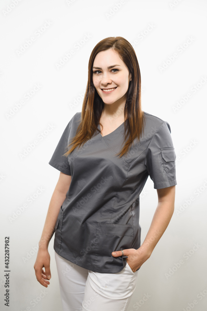 Smiling medical doctor woman isolated over white background Smiling medical doctor woman isolated over white background