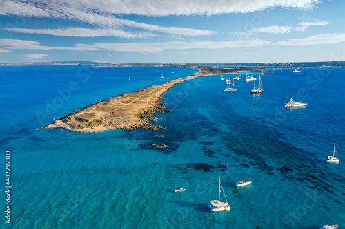 Aerial view over the clear beach and turquoise water of Formentera, Ibiza.