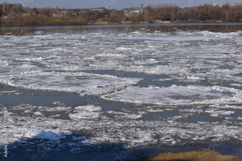 Early spring. View from the river bank to the opposite bank during the ice drift.