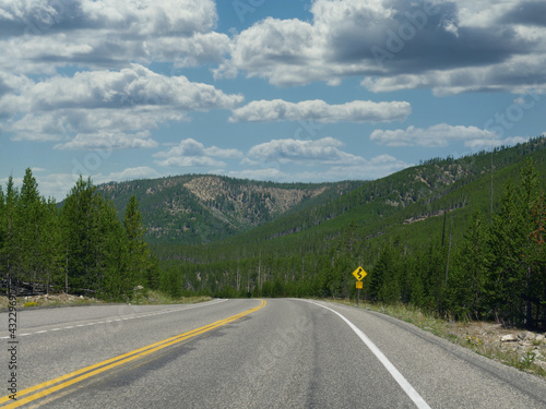 Paved road and landscape at Yellowstone National Park, Wyoming.