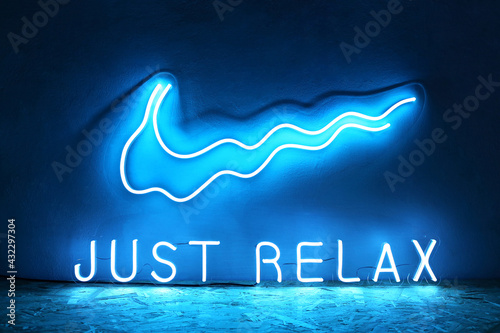 Blue neon sign just relax. Trendy style. Neon sign. Custom neon. Home decor. photo