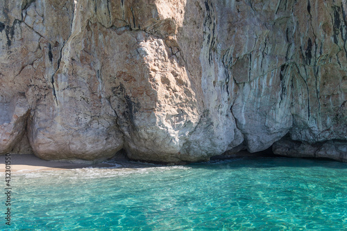 Amazing turquoise sea, piece of wild beach and white rocks, Albania. Travel theme, beautiful nature