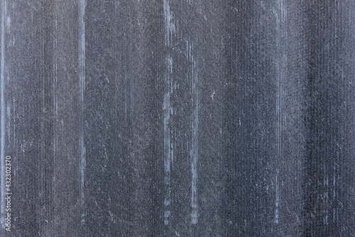 Texture of shabby tiles. Gray wavy panel background