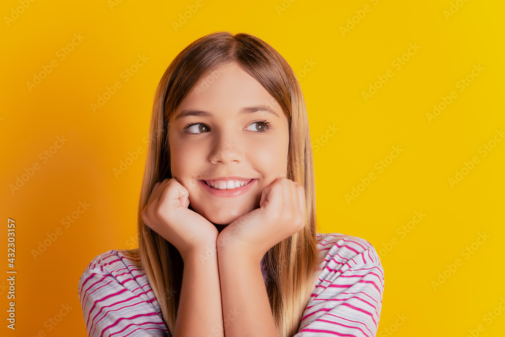 Dreamy schoolgirl touch cheekbones hands look empty space vibrant yellow background Dreamy schoolgirl touch cheekbones hands look empty space vibrant yellow background