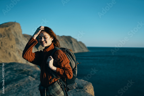 cheerful woman hiker outdoors rocky mountains adventure landscape