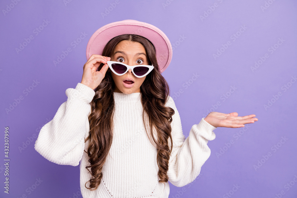 Photo of young girl amazed shocked surprised confused unsure fake novelty isolated over purple color background Photo of young girl amazed shocked surprised confused unsure fake novelty isolated over purple color background