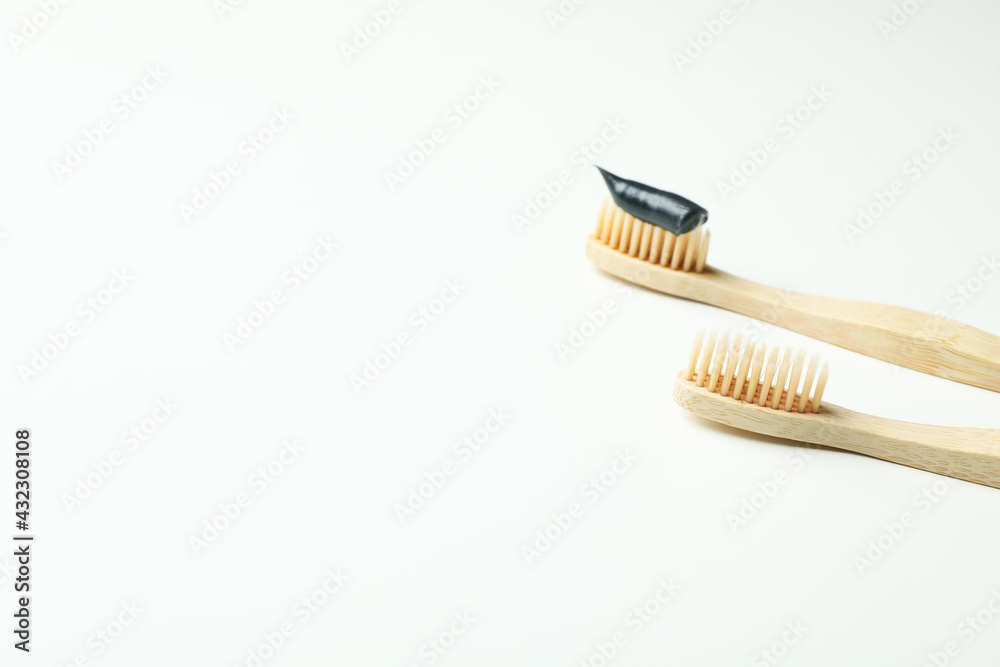 Eco friendly wooden toothbrushes on white background Eco friendly wooden toothbrushes on white background