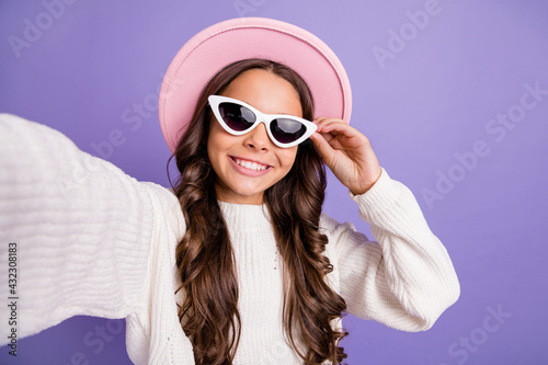 Photo of young schoolgirl happy positive smile make take self photo selfie isolated over purple color background