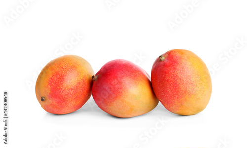 Delicious ripe juicy mangoes on white background