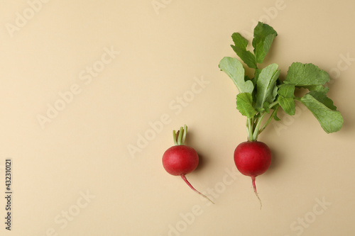 Fresh radish on beige background, space for text photo