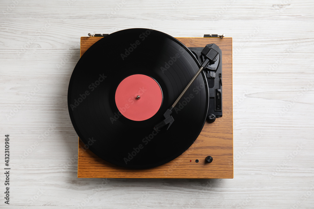 Modern vinyl record player with disc on white wooden background, view Stock Photo | Adobe Stock