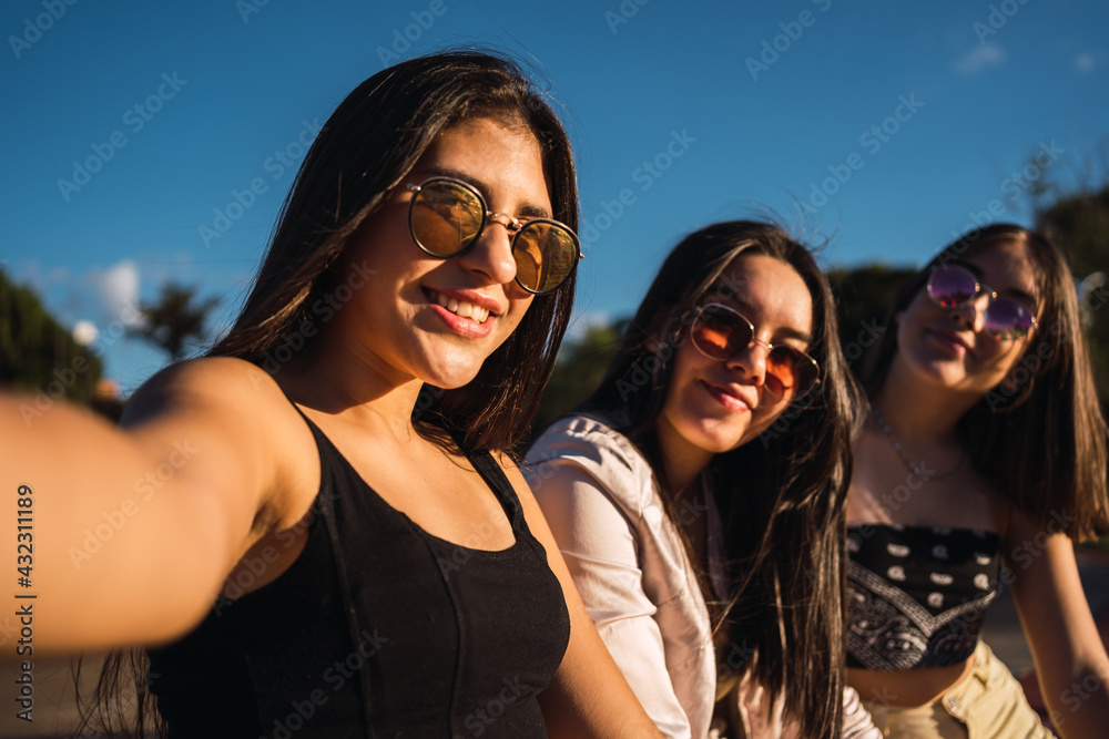 Portrait of happy friends smiling in an urban park. Portrait of happy friends smiling in an urban park.