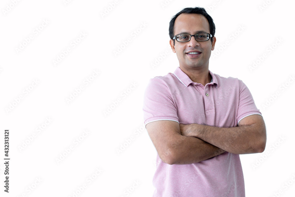 Portrait of a happy Indian man, arms folded over white background and looking at camera, with clipping path Portrait of a happy Indian man, arms folded over white background and looking at camera, with clipping path