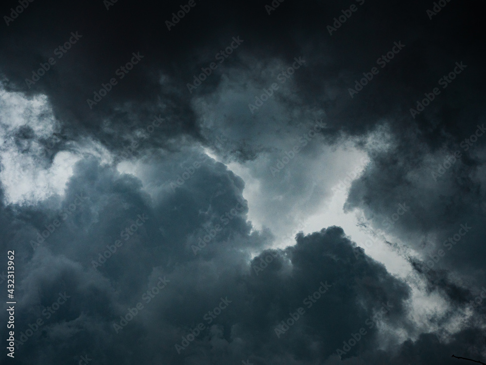 Dramatic dark grey clouds sky with storm and rain.