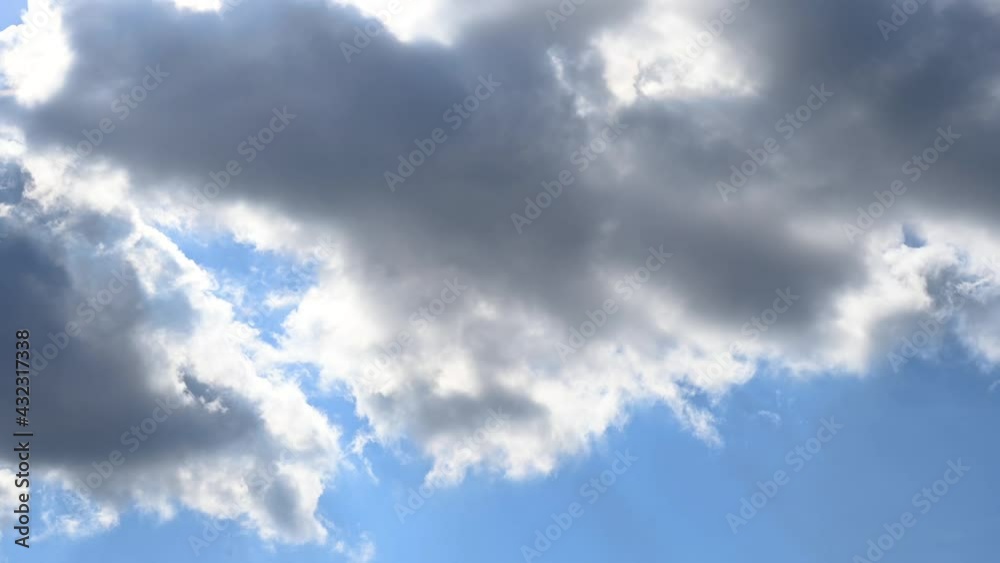 Blue sky with white gray clouds and sun, timelapse. Beautiful nature cloudy time lapse background, 4k Blue sky with white gray clouds and sun, timelapse. Beautiful nature cloudy time lapse background, 4k