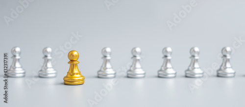 Gold Chess Pawn figure Stand out from the crowd on Chessboard background. Strategy, leadership, business, teamwork, different, Unique and Human resource management concept