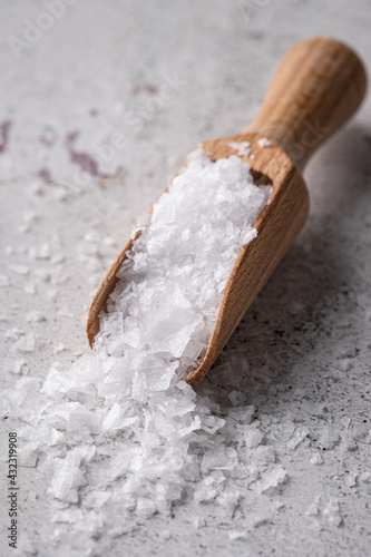 Maldon sea salt flakes in wooden spoon photo