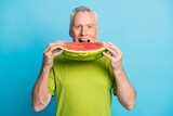 Photo of positive aged man arms hold slice of watermelon open mouth isolated on blue color background