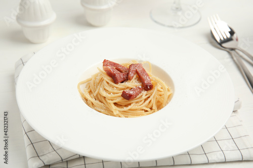 Delicious Carbonara pasta served on white table