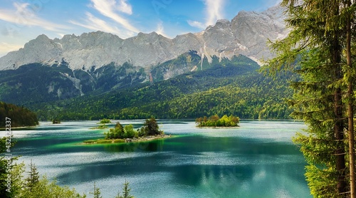 Eibsee lake with view to islands and Zugspitze moutain in the back