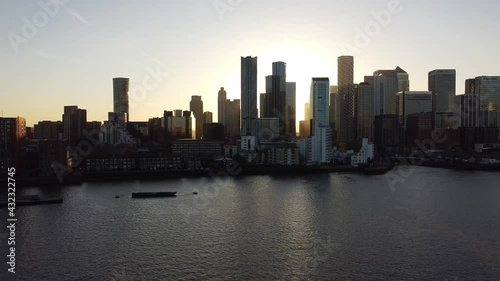 Wallpaper Mural Drone wide shot of urban silhouette next to River Thames during sunset in backdrop. Canary Wharf district of London,Uk. Torontodigital.ca