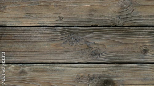 Old wood texture with knots move from right to left.