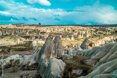 Amazing panorama view of unique rock formations and typical fairy chimneys in Göreme, Cappadocia, Turkey