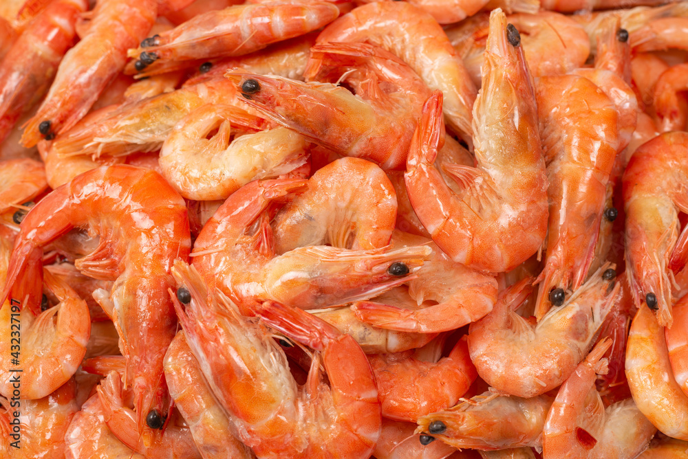 Shrimps background texture. A lot of shrimps. Cooked shrimps.