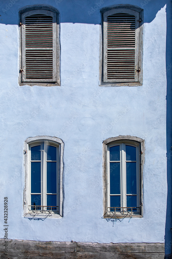 Blue stucco house in the town of Mirepoix, France.