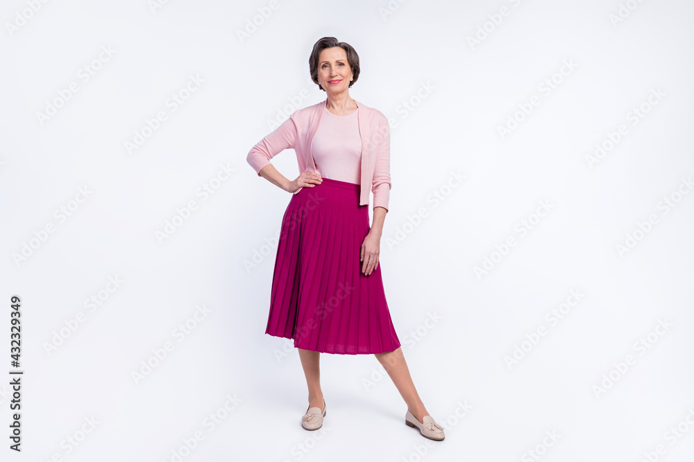Full length photo of elderly attractive woman happy positive smile confident stylish isolated over grey color background Full length photo of elderly attractive woman happy positive smile confident stylish isolated over grey color background