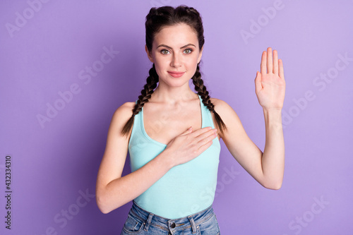 Bild auf Leinwand Photo of happy pretty sincere young woman hold hand chest make pledge isolated o