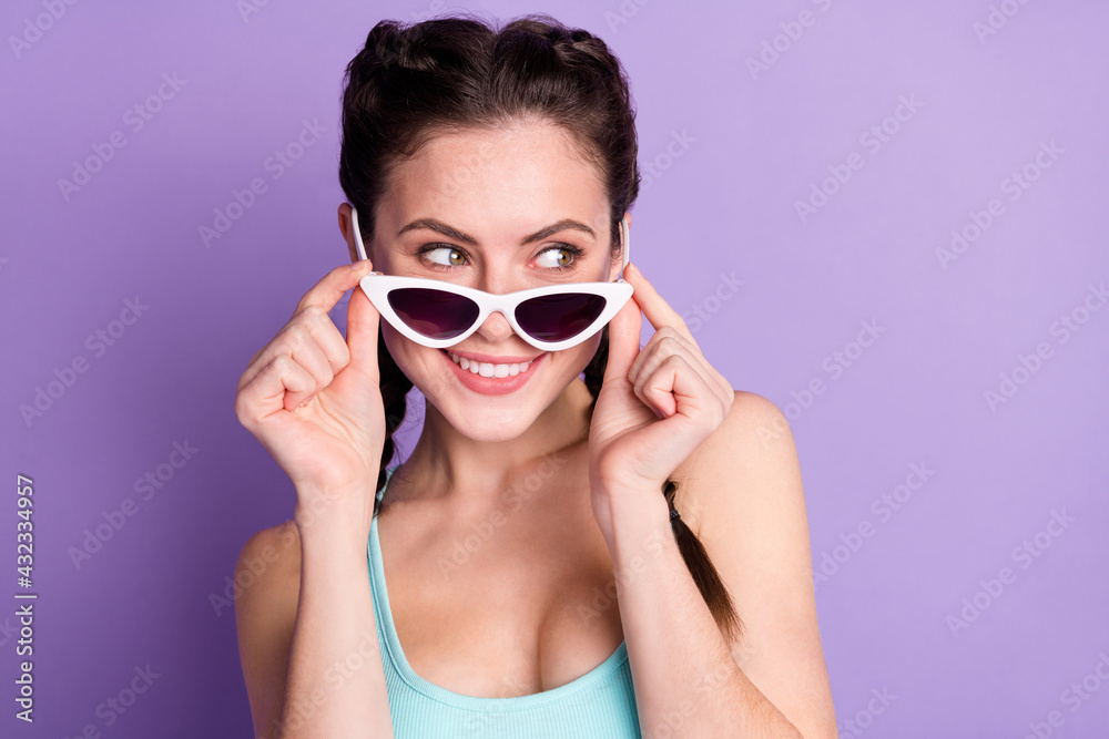 Close-up portrait of attractive cheerful girlish girl touching specs looking isolated over violet purple color background