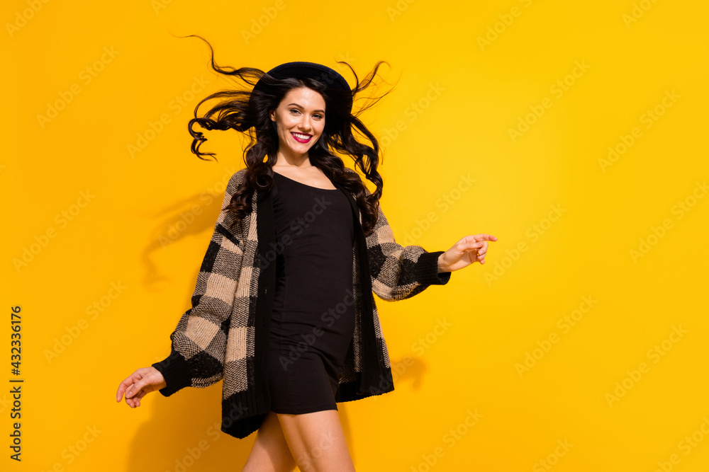 Photo of attractive happy young woman walk weekend rest smile copyspace isolated on yellow color background Photo of attractive happy young woman walk weekend rest smile copyspace isolated on yellow color background